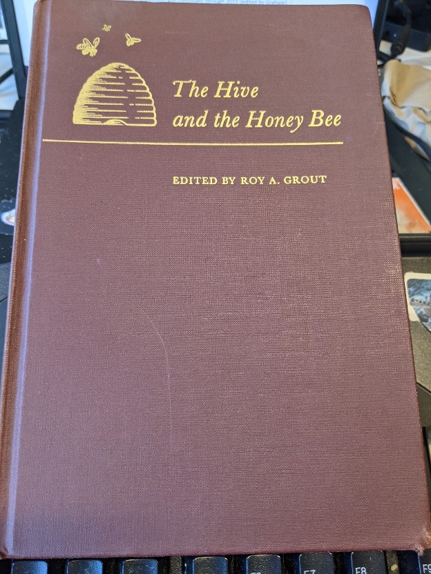 A photo of the book “The Hive and the Honey Bee, Edited by Roy A. Grout.” 