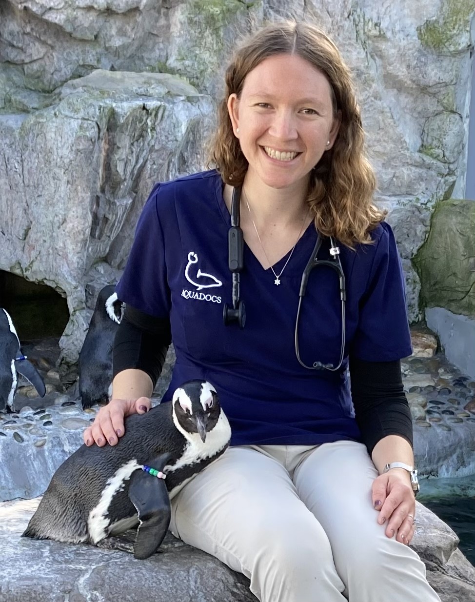 Michelle Greenfield portrait, shown with a captive penguin.