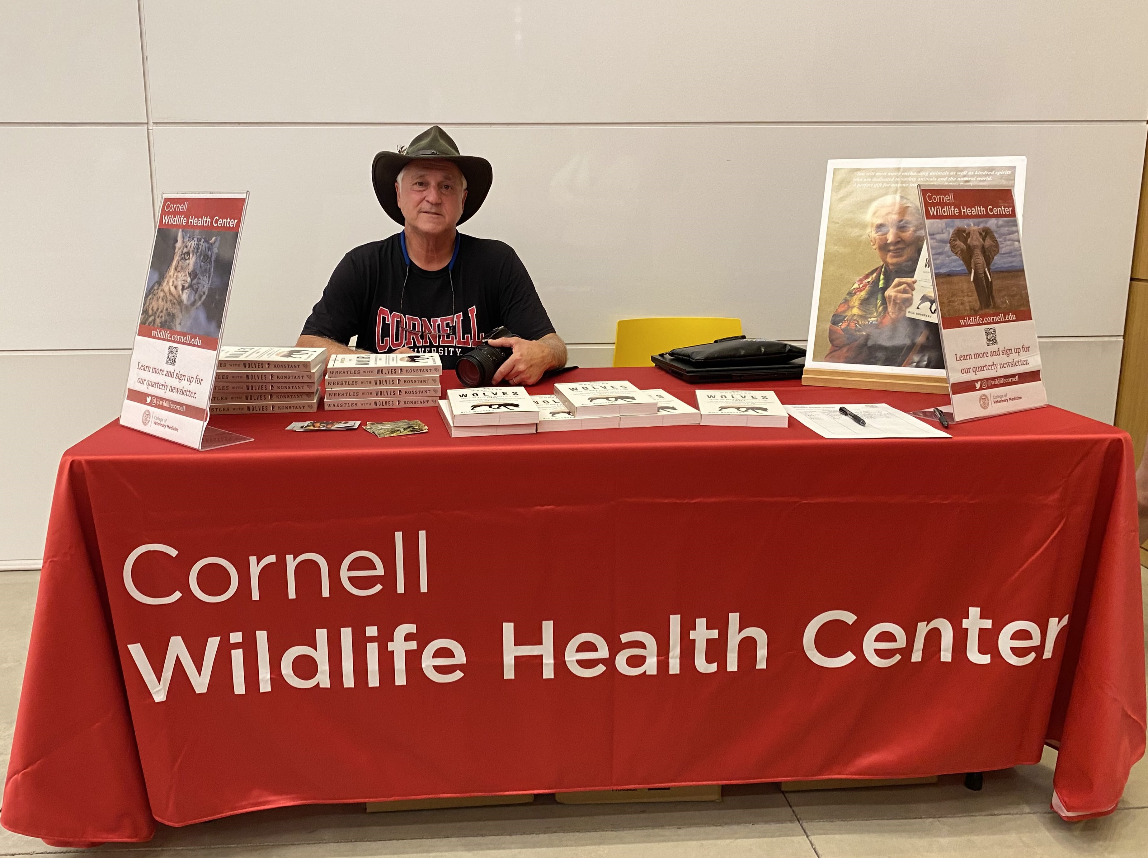 Bill Konstant at book signing table with the Cornell Wildlife Health Center