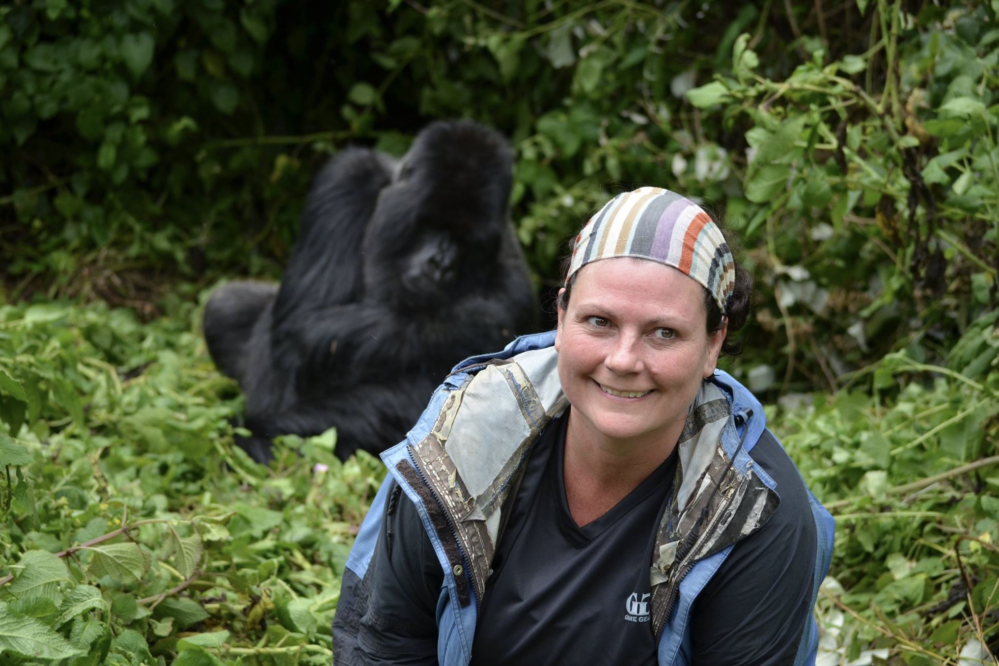Dr. Hayley Murphy with a primate in the background