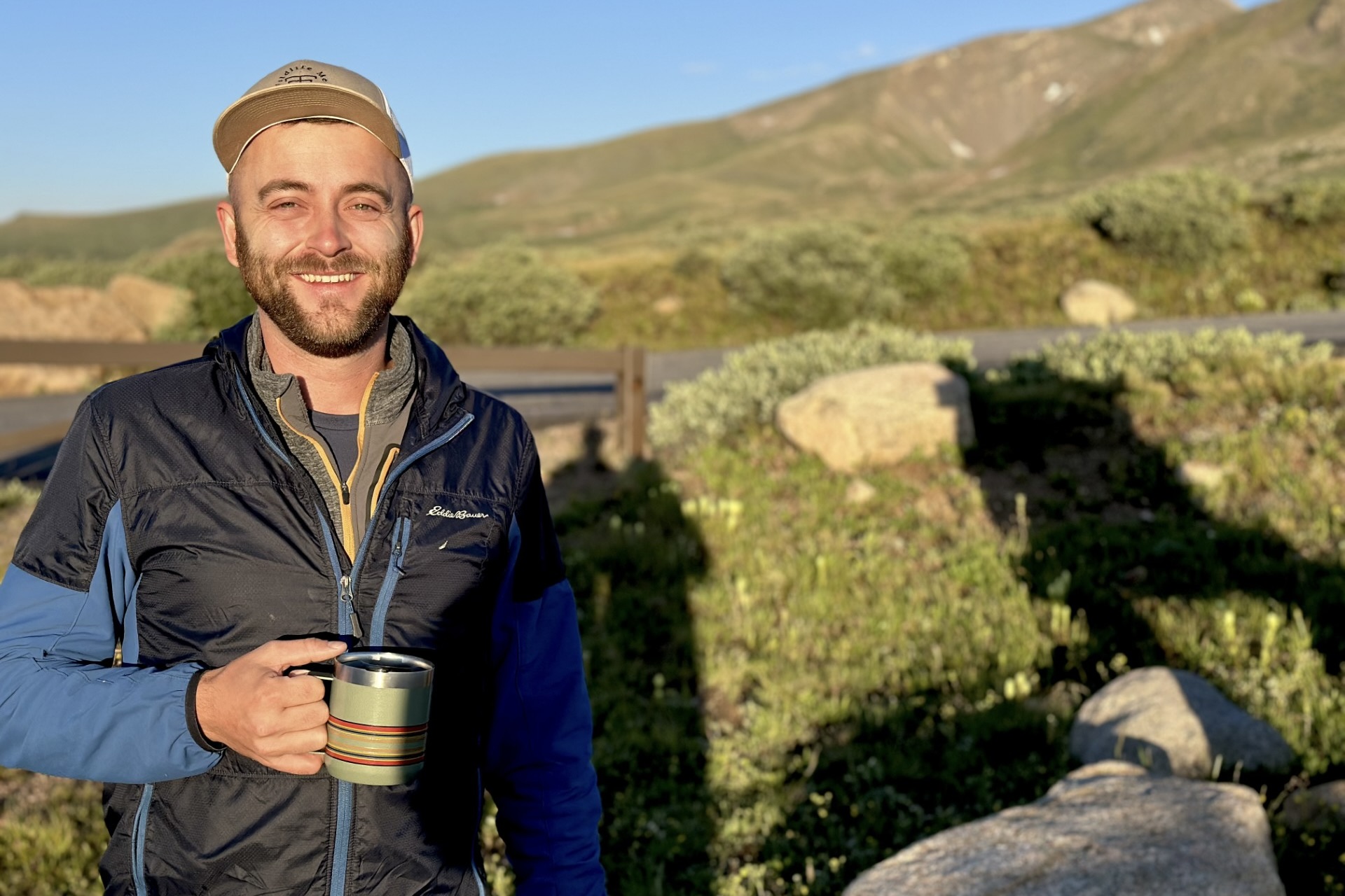 J Hunter Reed smiling with mountains in the background