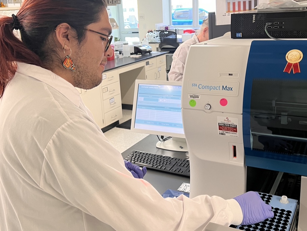 Sergio loading samples in the lab