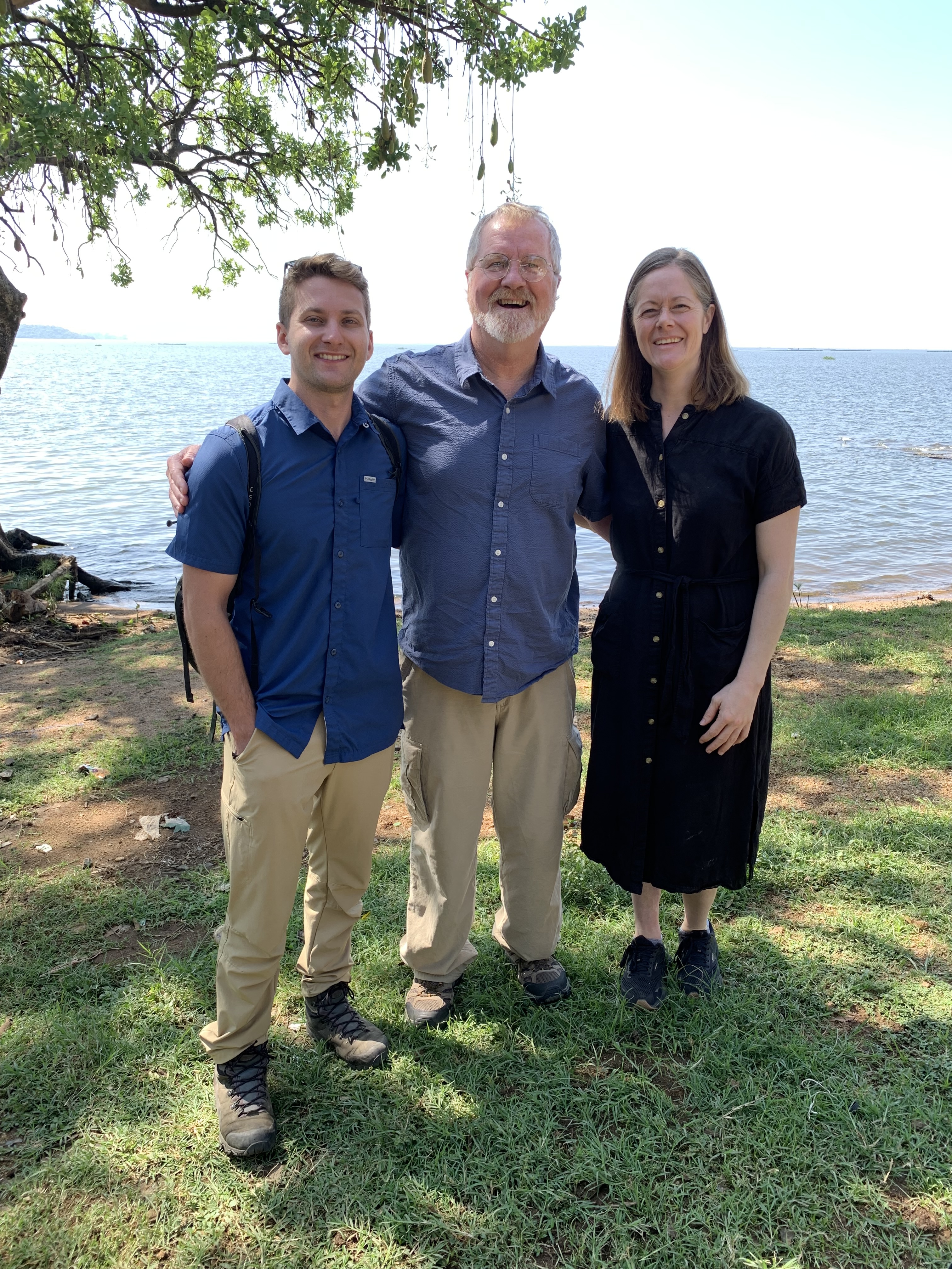 Dr. Getchell stands in the middle between Dr. Eric Teplitz and Dr. Katie Fiorella as they smile  with the ocean in the background.