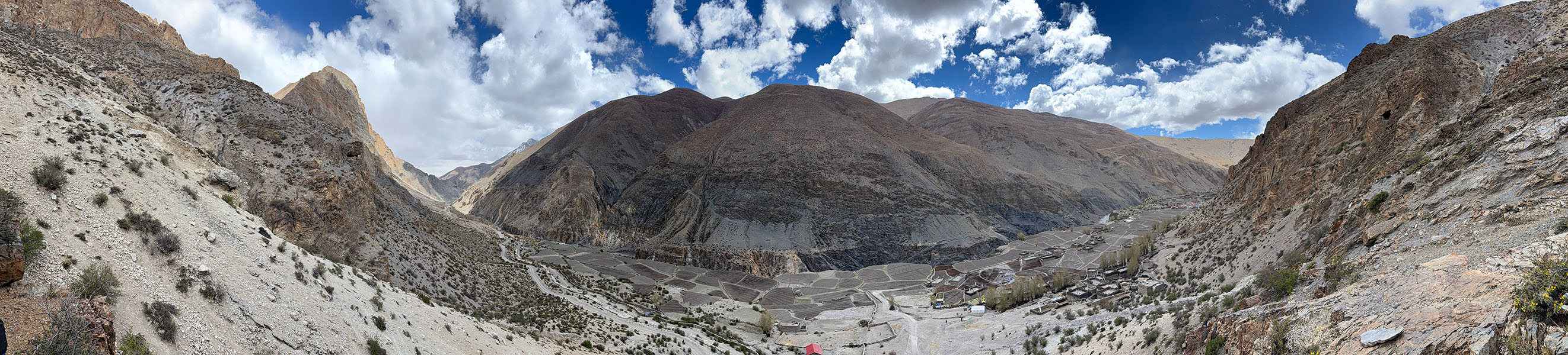 Shimen village surrounded by dramatic giant mountains