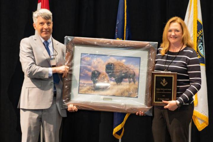 Dr. Krysten L. Schuler of Cornell University receiving The Robert McDowell Award for Conservation Management Excellence.