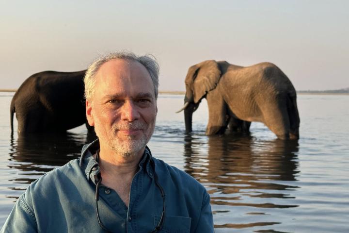 Dr. Steve Osofsky with wild elephants in the background