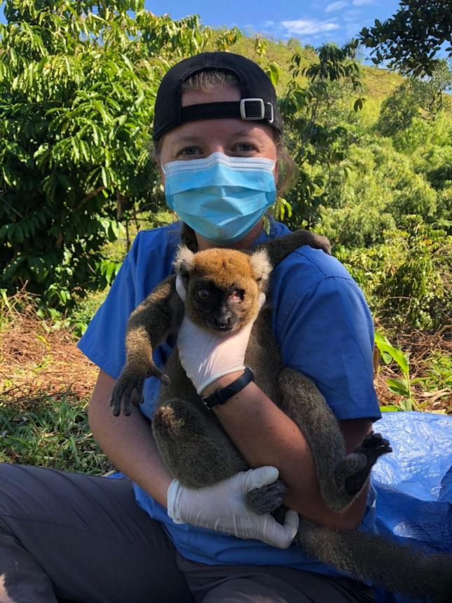 CVM student holding a Lemur before releasing back into the wild