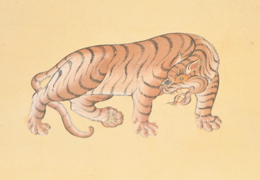 A tiger painted on a building in Thimphu; tigers are particularly revered in Bhutan. COURTESY MARTIN GILBERT