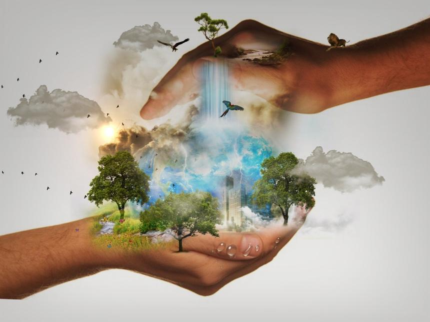 A graphical representation of taking care of the Earth, showing two hands clasping the natural world with buildings in the middle