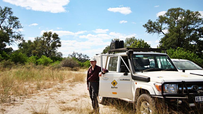 Steve Osofsky standing by jeep in Bwabwata National Park