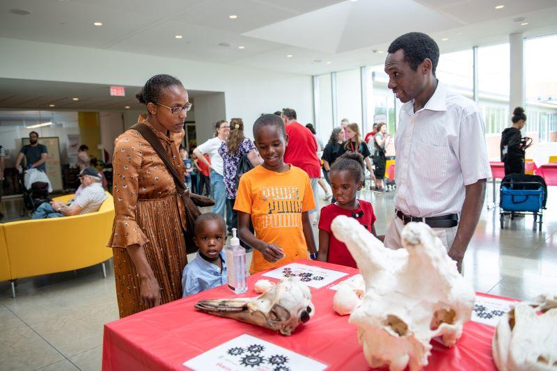 Annual Open House at the Veterinary College scene with family and staff.