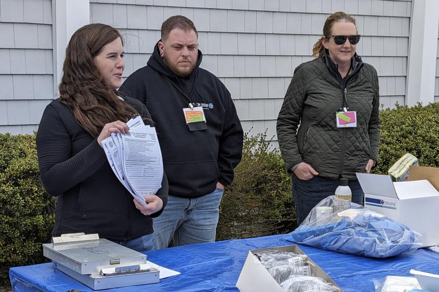 Melanie demonstrating sampling protocols with DEC Research Scientist, Landon Miller and CWHL Director Krysten Schuler