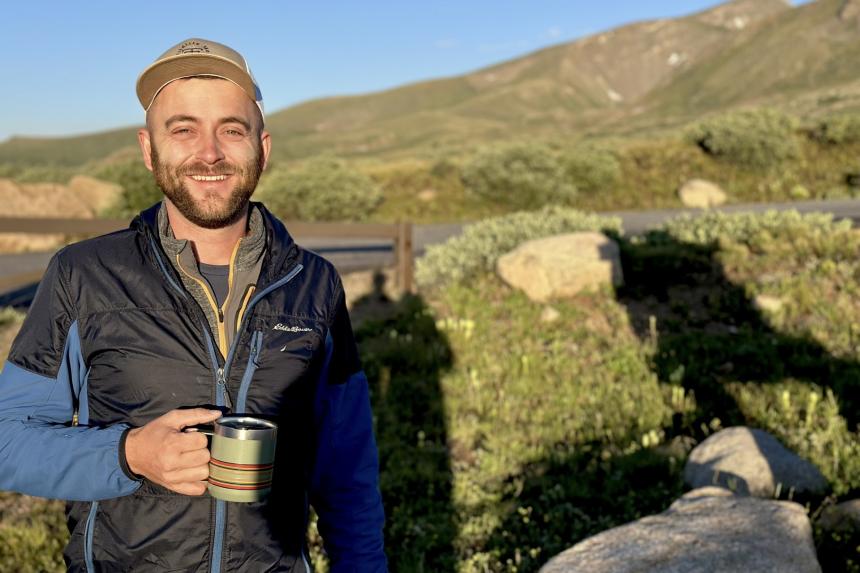 J Hunter Reed smiling with mountains in the background