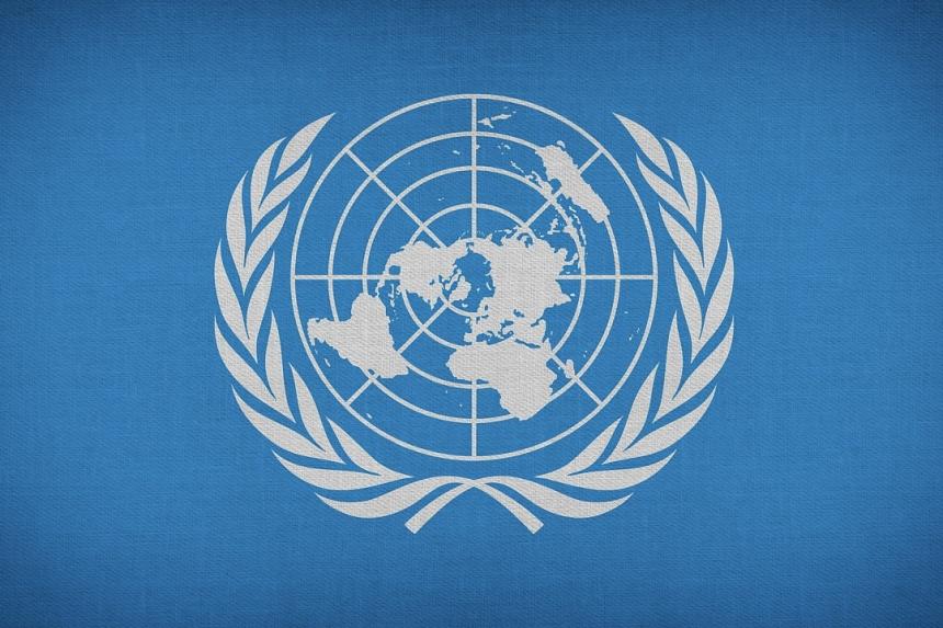 United Nations symbol in white on a blue background
