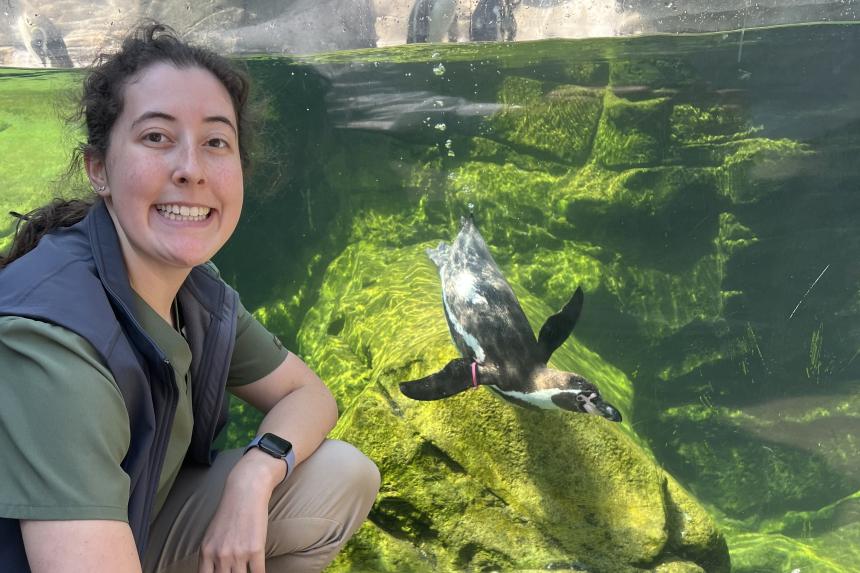 Sarah in front of the penguin exhibit