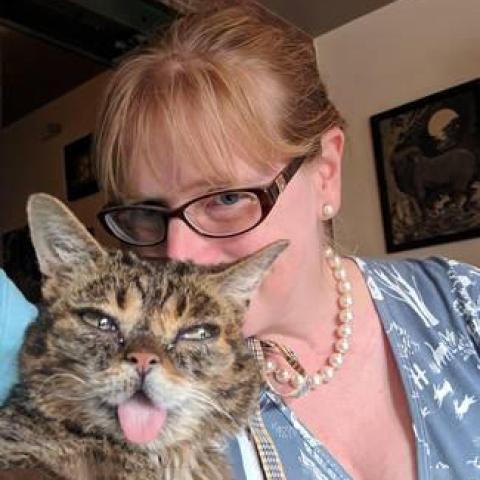 A portrait of Karyn Bischoff with her cat.